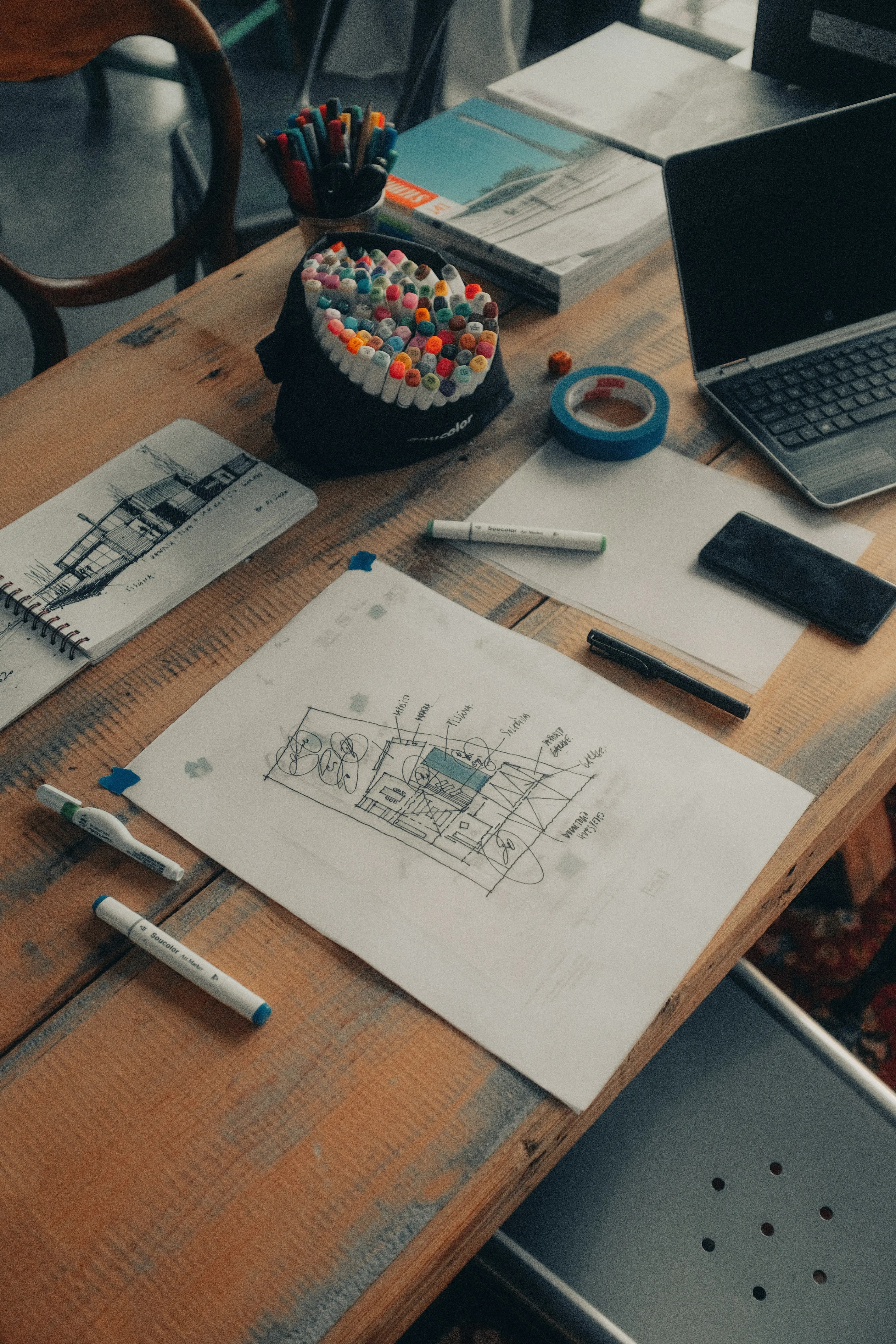 Architectural sketchbooks and lifestyle planning elements capturing the initial design discovery phase.